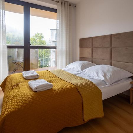 Aparthotel City Center Apartments Krynica Zdroj Bagian luar foto